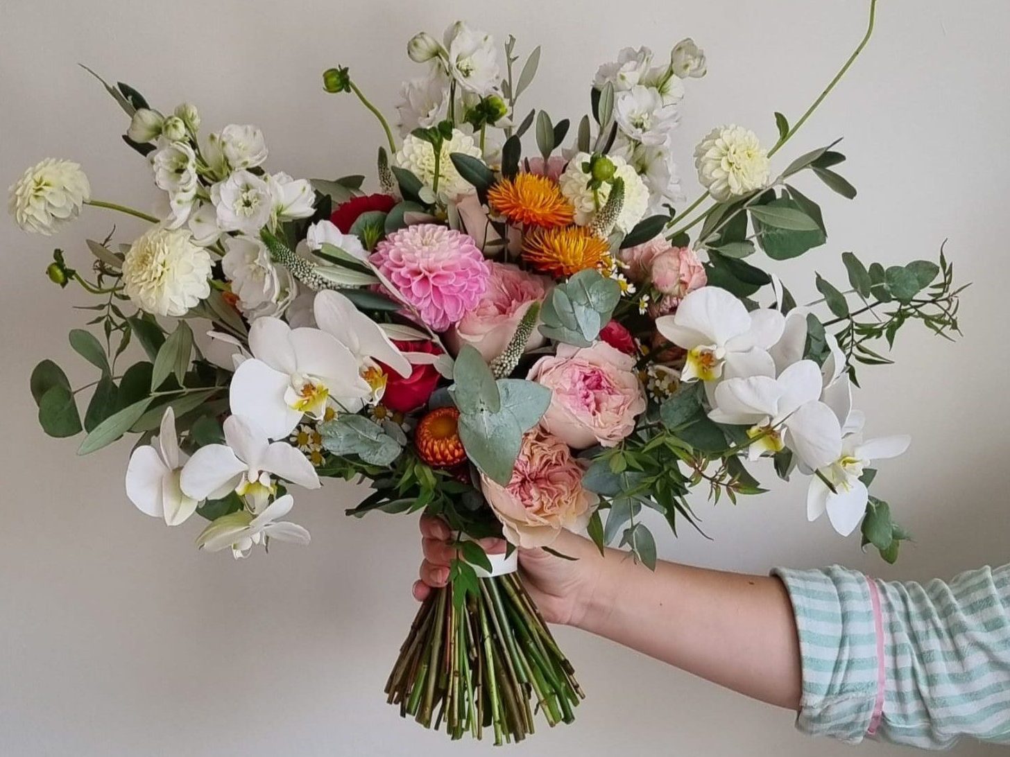 Bright pinks, oranges and white timeless bridal bouquet by The Flowers of May